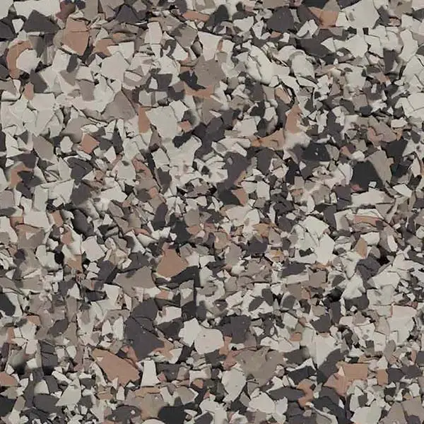 A close-up of a textured surface with an abstract pattern of randomly scattered brown, gray, and white pieces.