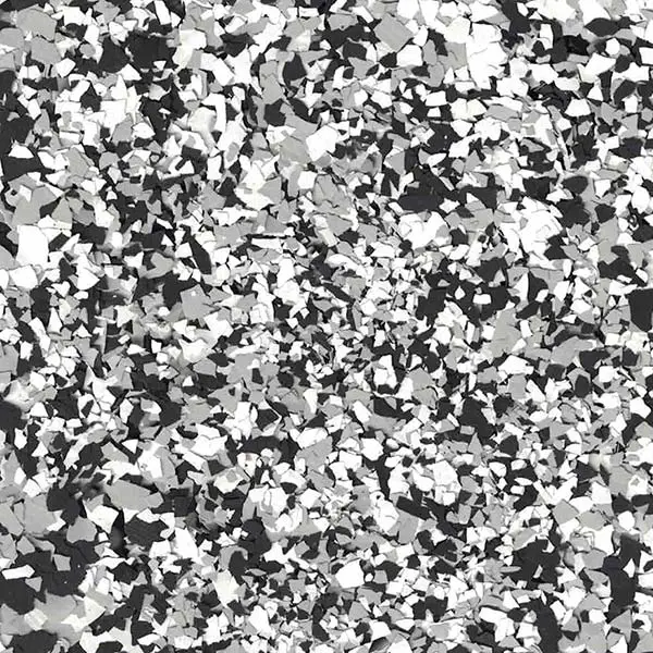 This image displays a detailed pattern of randomly scattered black, white, and gray fragments, creating a textured, abstract background.