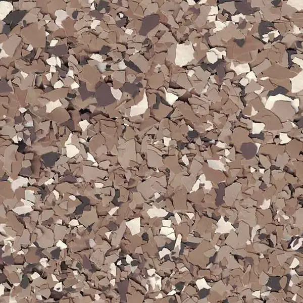 The image shows a close-up of a textured, multicolored surface resembling fragmented rocks or gravel in various earthy tones.